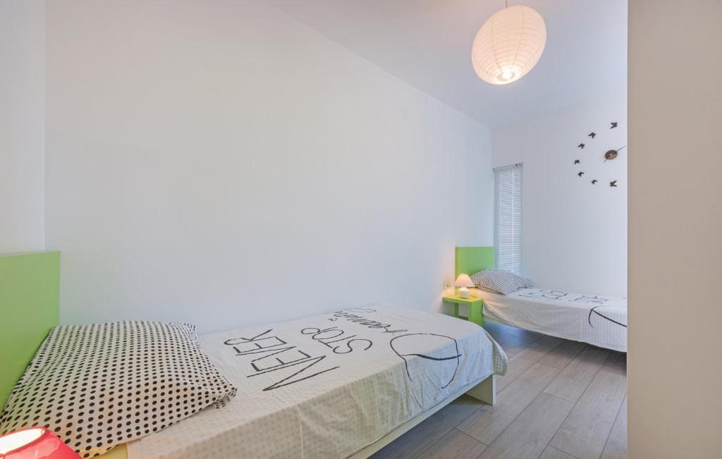 Postel nebo postele na pokoji v ubytování Apartment Belas