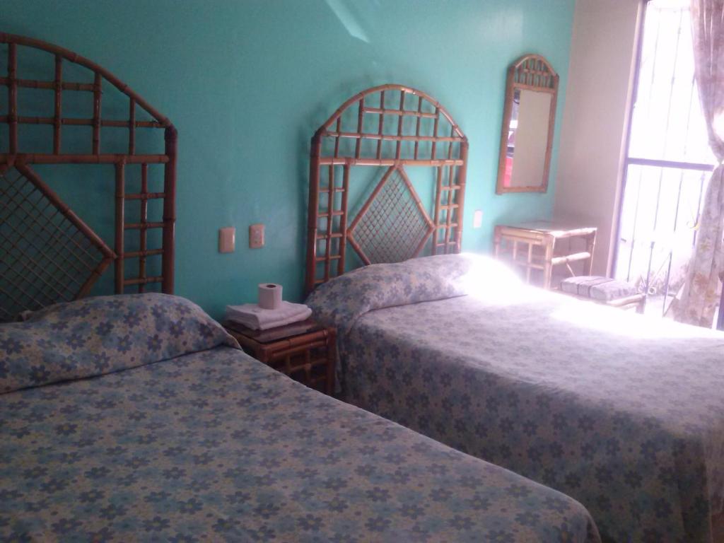 Postel nebo postele na pokoji v ubytování Hotel Angela Carolina