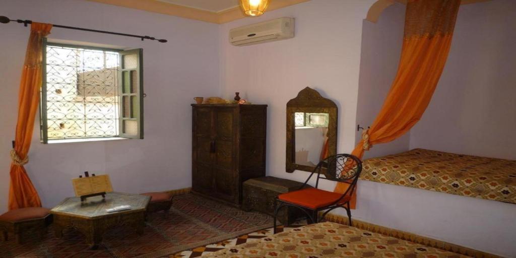 Postel nebo postele na pokoji v ubytování Riad Jomana