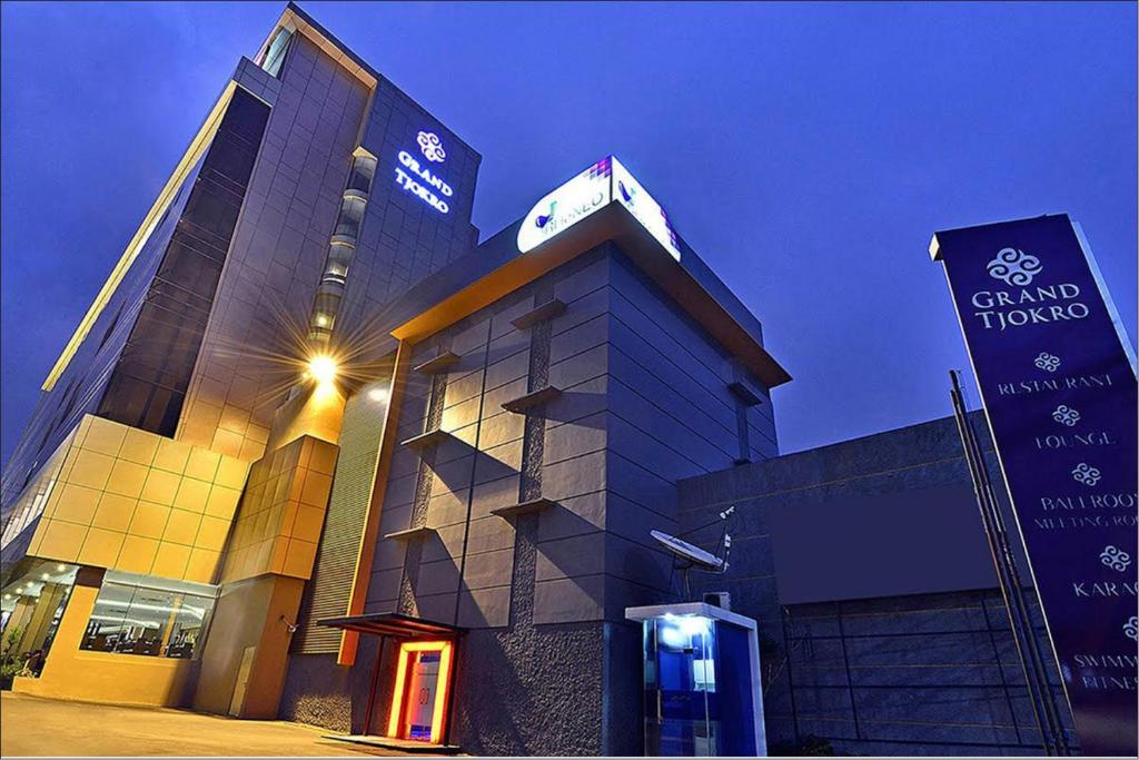 a building with a pay phone in front of it at Grand Tjokro Jakarta in Jakarta