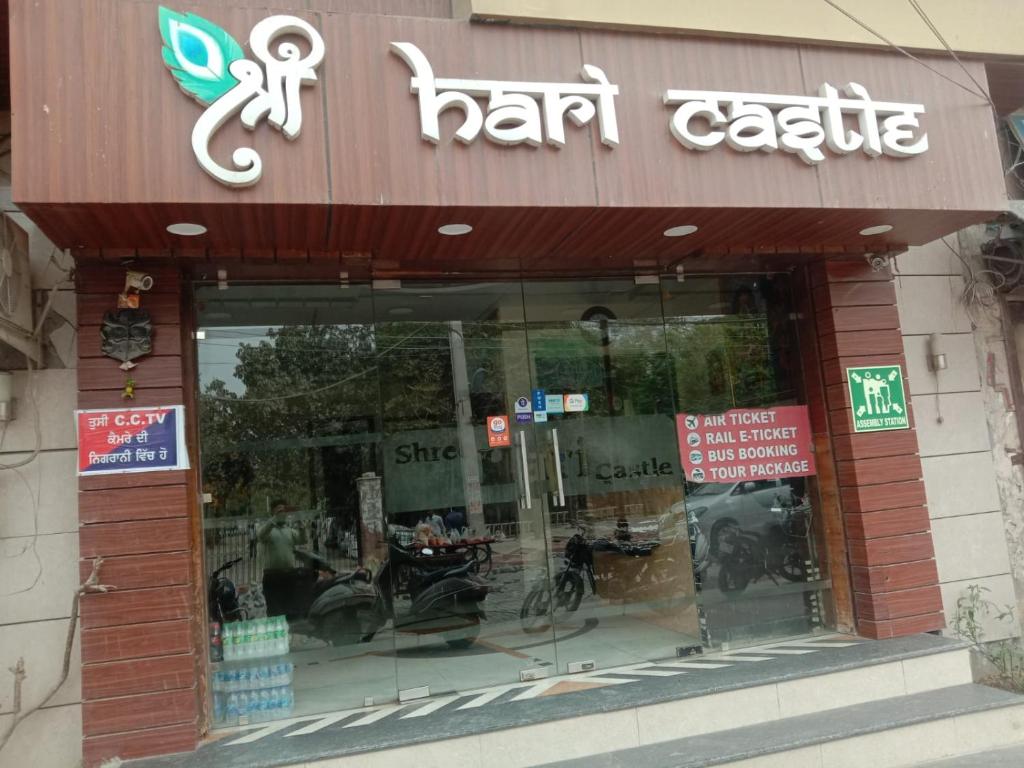 a store front of a hair cafe with a sign on it at Shree Hari castle in Amritsar