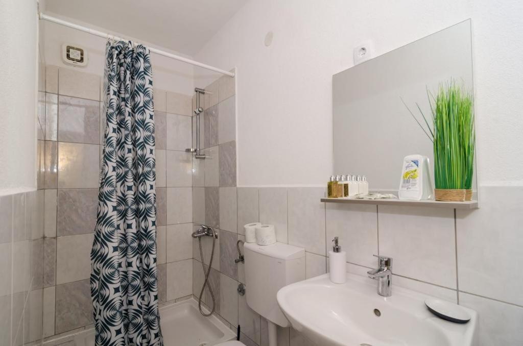 Koupelna v ubytování Apartments Ammos
