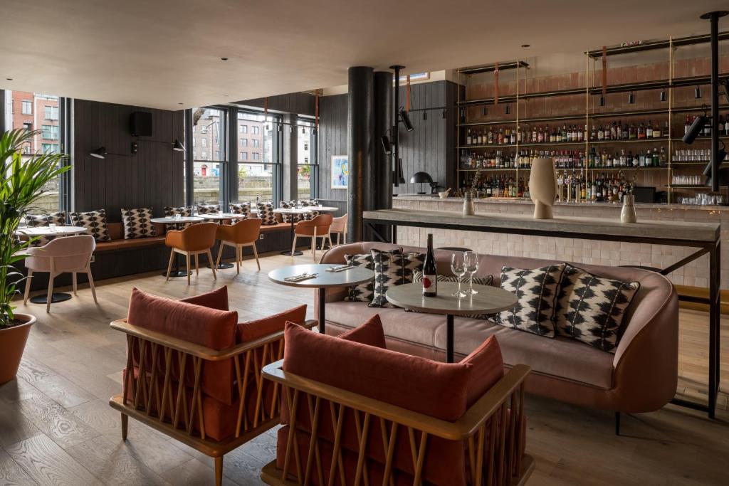 a restaurant with tables and chairs and a bar at Zanzibar Locke in Dublin