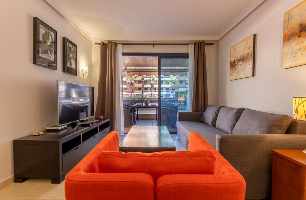 A television and/or entertainment centre at Balcon de Los Gigantes 2A016