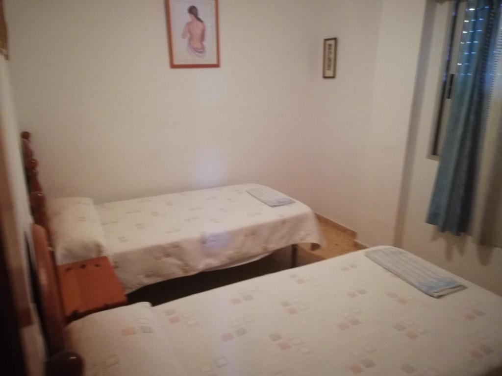 Postel nebo postele na pokoji v ubytování Xeracsol I Solo Familias Serviplaya