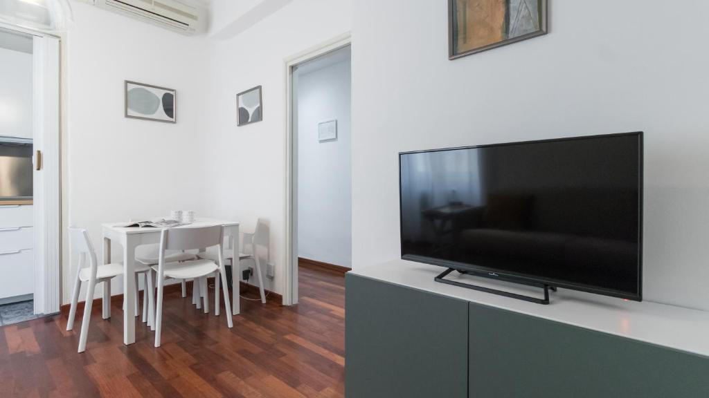 Televízia a/alebo spoločenská miestnosť v ubytovaní Italianway - Col di Lana 6/A - C