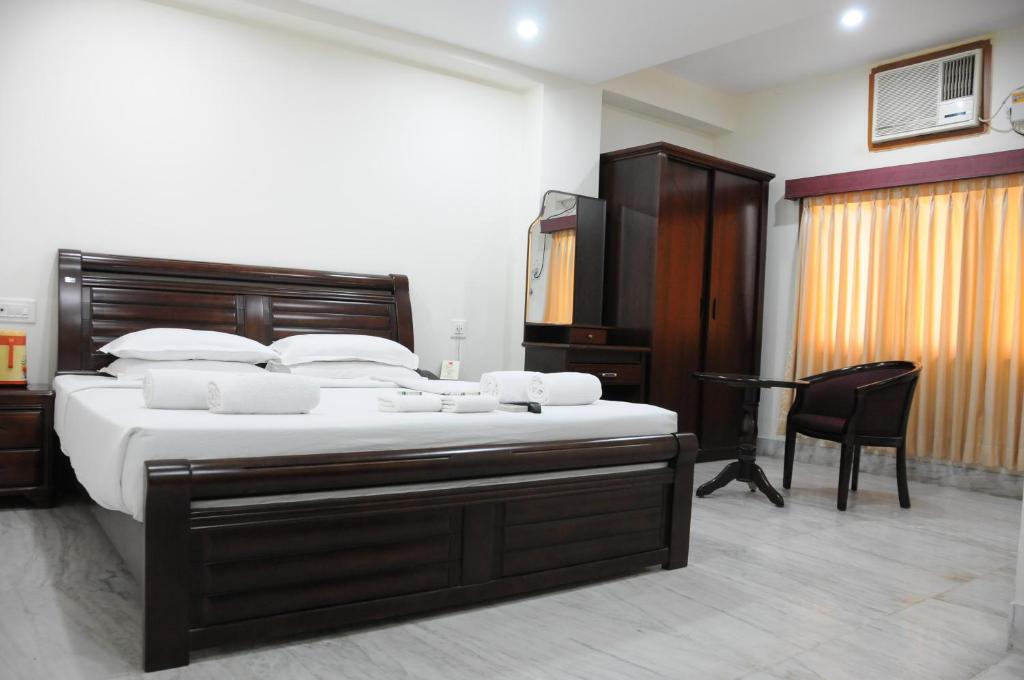 Postel nebo postele na pokoji v ubytování Lloyds Serviced Apartments, Near Music Academy