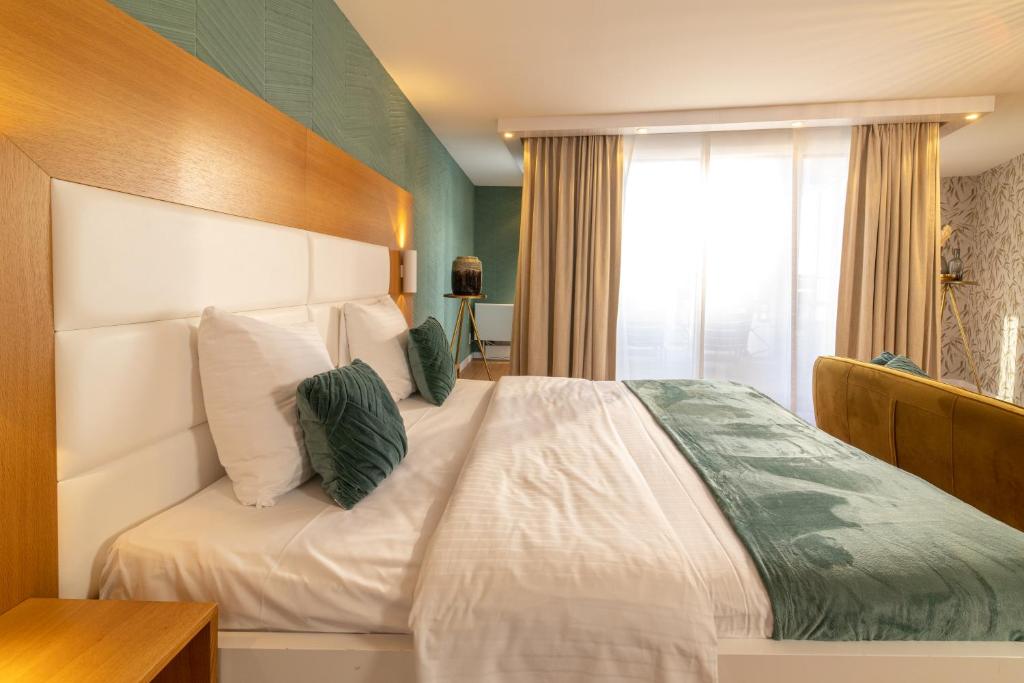 Postel nebo postele na pokoji v ubytování Van der Valk Hotel Beveren