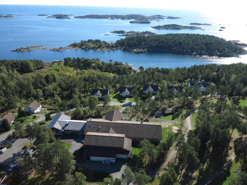 an aerial view of a house on the shore of a lake at BiG Bed & Breakfast in Grimstad