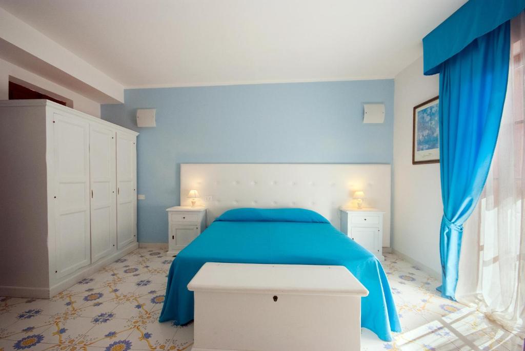 Postel nebo postele na pokoji v ubytování Hotel Residence Villa San Giovanni