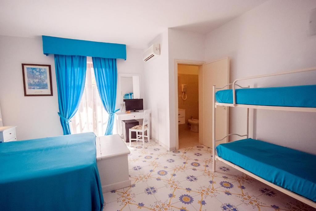 Postel nebo postele na pokoji v ubytování Hotel Residence Villa San Giovanni