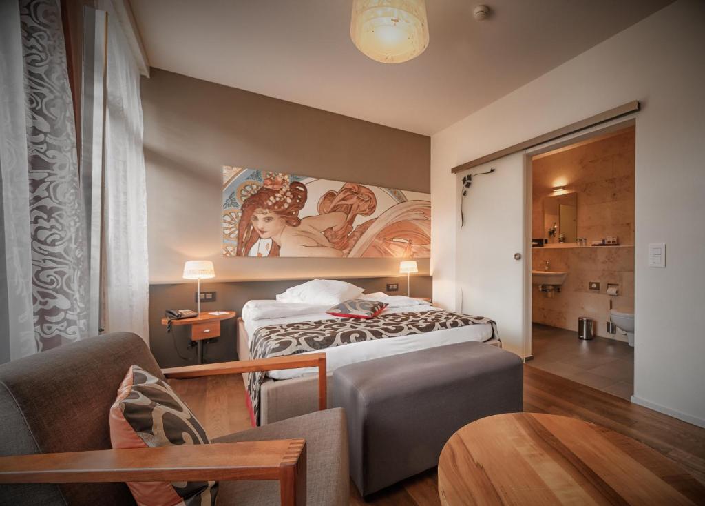 Postel nebo postele na pokoji v ubytování Belvédère Strandhotel