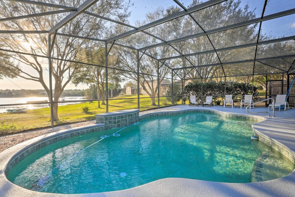 an indoor swimming pool with a pergola at Dog-Friendly Lake Home with Dock about 25 Mi to Disney! in Clermont