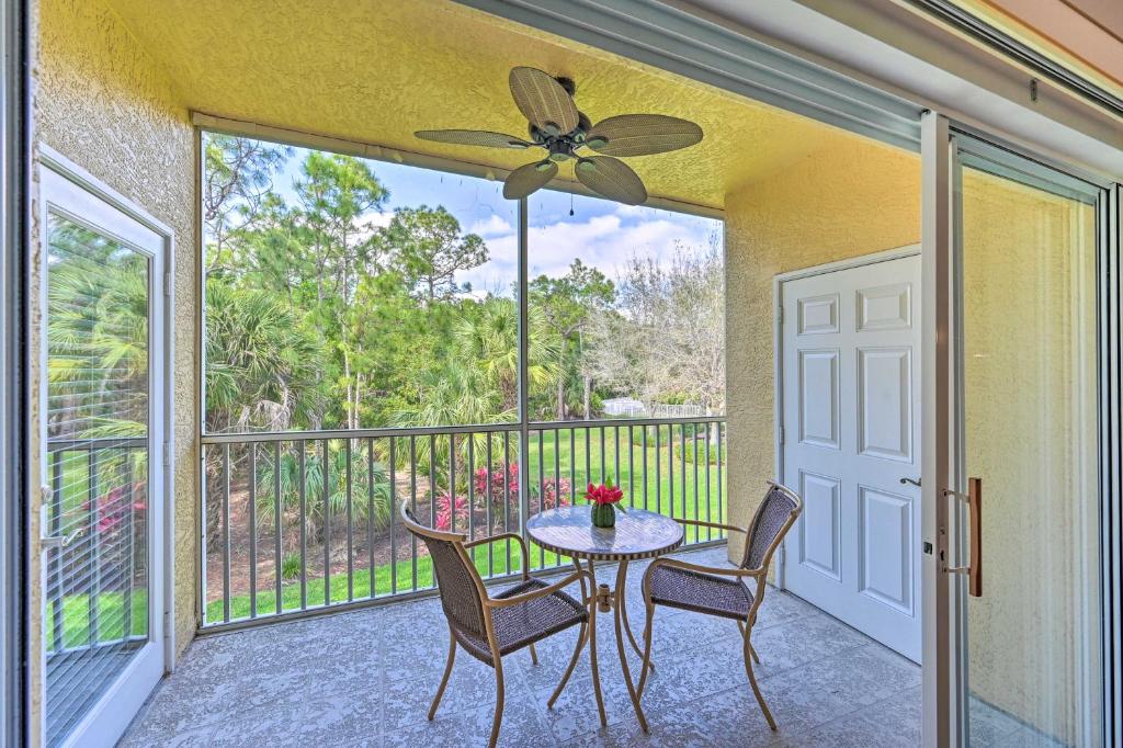 a patio with a table and chairs on a balcony at Quiet Lely Resort Condo with Pool - 2 Mi to Golf! in Naples