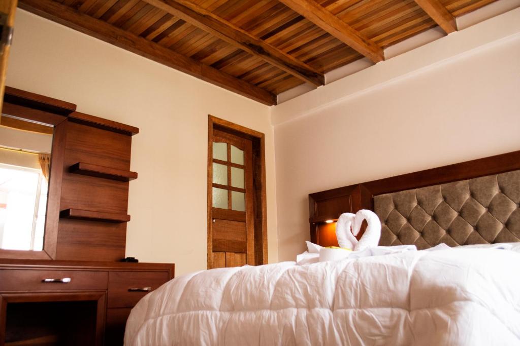 Postel nebo postele na pokoji v ubytování Hotel Imperial Zumbahua & Quilotoa Lodge