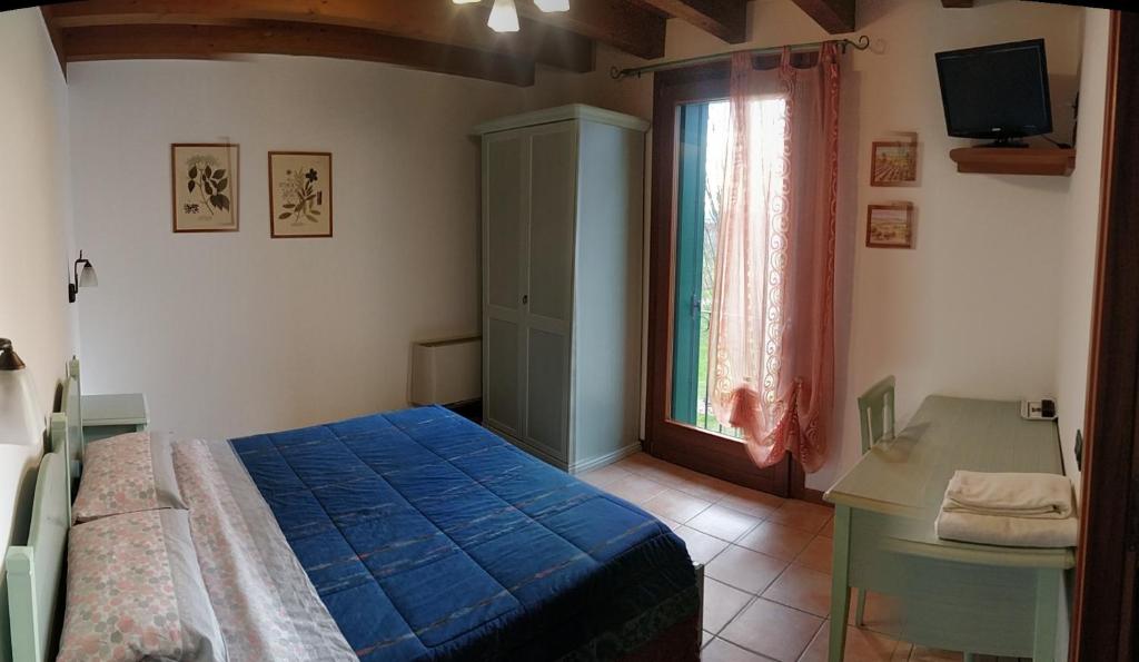 Posteľ alebo postele v izbe v ubytovaní Agriturismo L'Albara - Wines, Pool & SPA