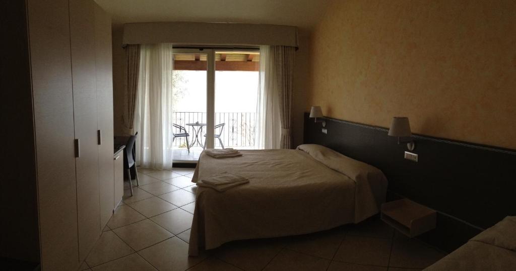 Postel nebo postele na pokoji v ubytování Hotel Lumin