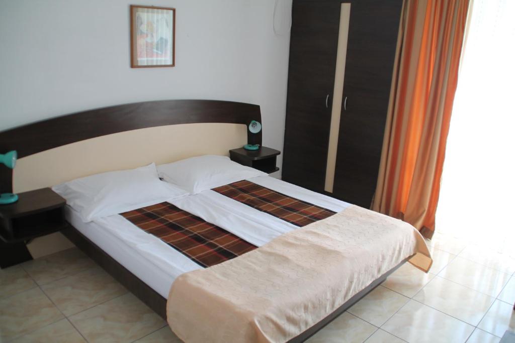 Postel nebo postele na pokoji v ubytování Hotel Metropol