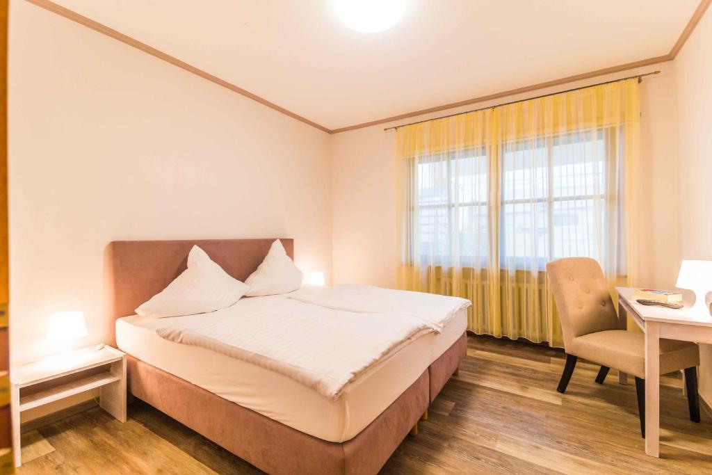 Postel nebo postele na pokoji v ubytování Hotel Braun
