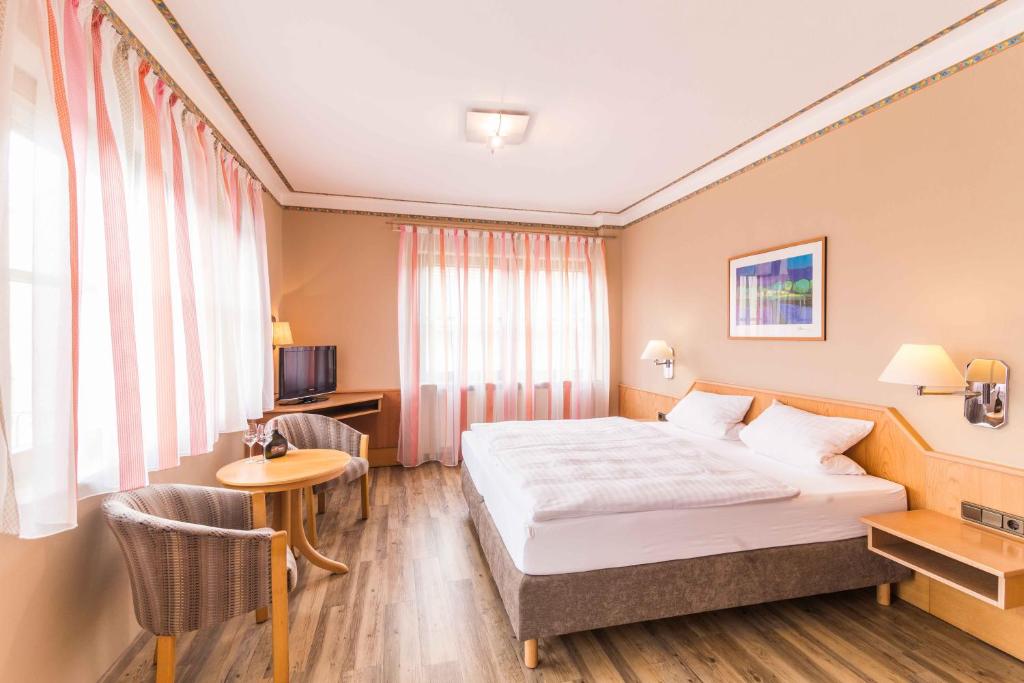 Postel nebo postele na pokoji v ubytování Hotel Braun