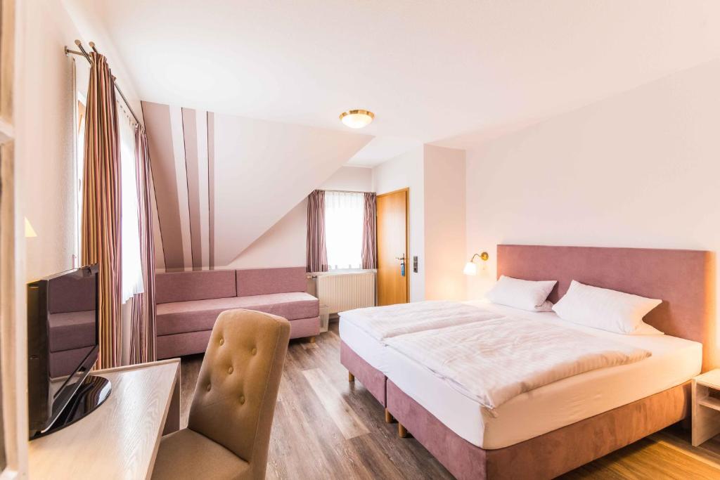 Postel nebo postele na pokoji v ubytování Hotel Braun