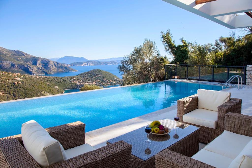 a villa with a pool and a view of the ocean at Villa Luxe in Sivota