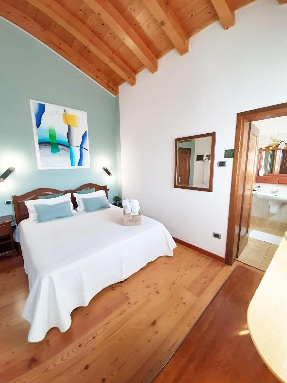 Postel nebo postele na pokoji v ubytování Agriturismo Le Cipressine