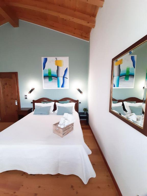 Postel nebo postele na pokoji v ubytování Agriturismo Le Cipressine