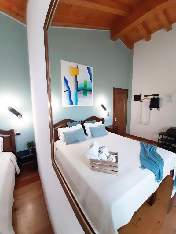 Postel nebo postele na pokoji v ubytování Agriturismo Le Cipressine