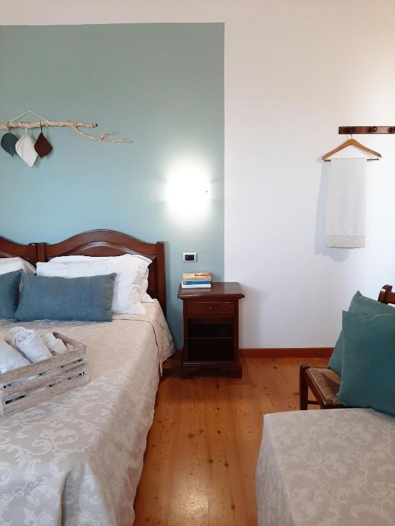 Postel nebo postele na pokoji v ubytování Agriturismo Le Cipressine