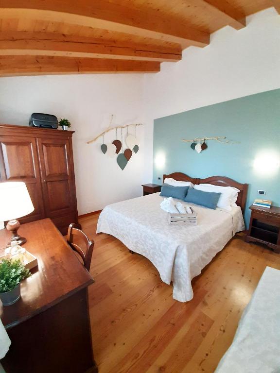 Postel nebo postele na pokoji v ubytování Agriturismo Le Cipressine