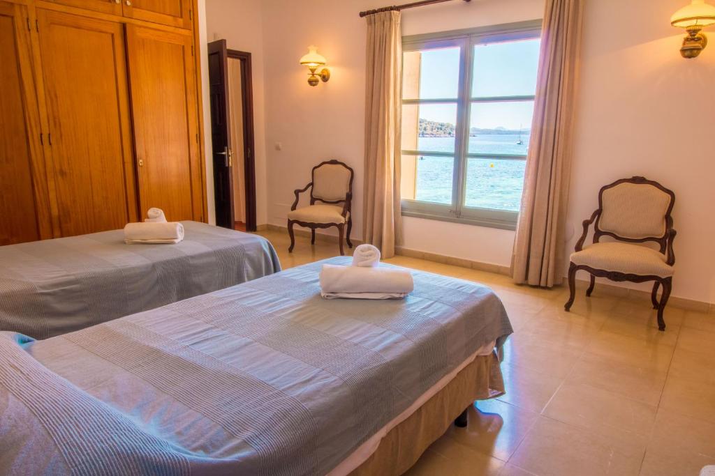 Postel nebo postele na pokoji v ubytování Villa Señorial primera linea de playa