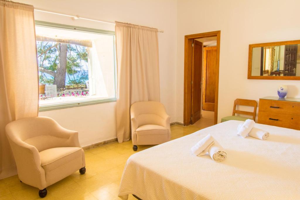 Postel nebo postele na pokoji v ubytování Villa Señorial primera linea de playa