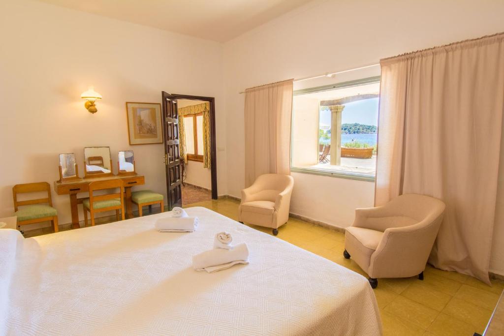 Postel nebo postele na pokoji v ubytování Villa Señorial primera linea de playa