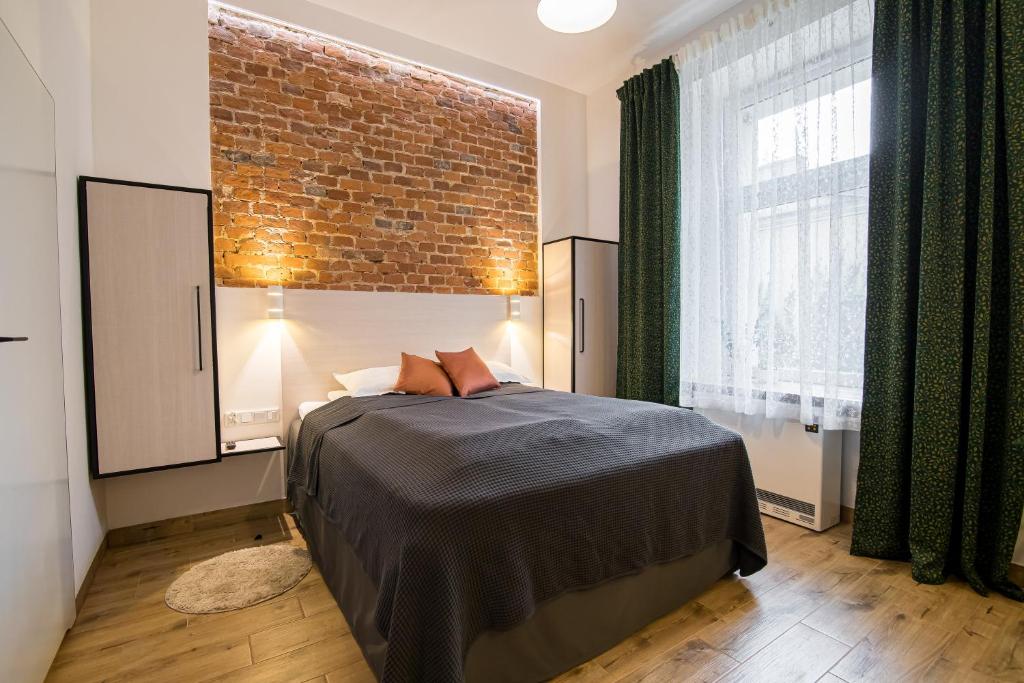 Postel nebo postele na pokoji v ubytování Green - Apartamenty Kleparskie