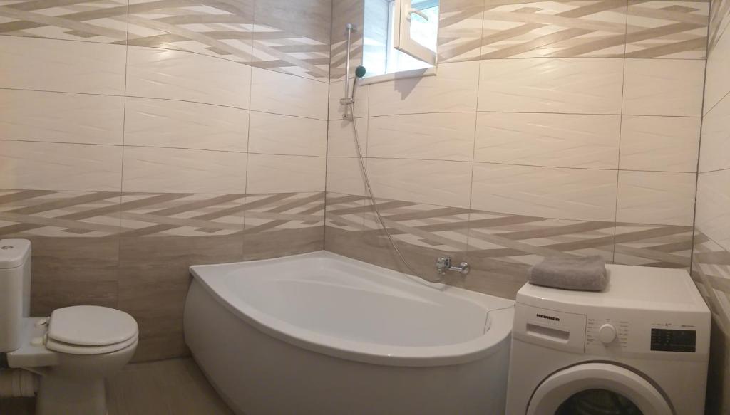 Kúpeľňa v ubytovaní Tölgyerdő Apartman