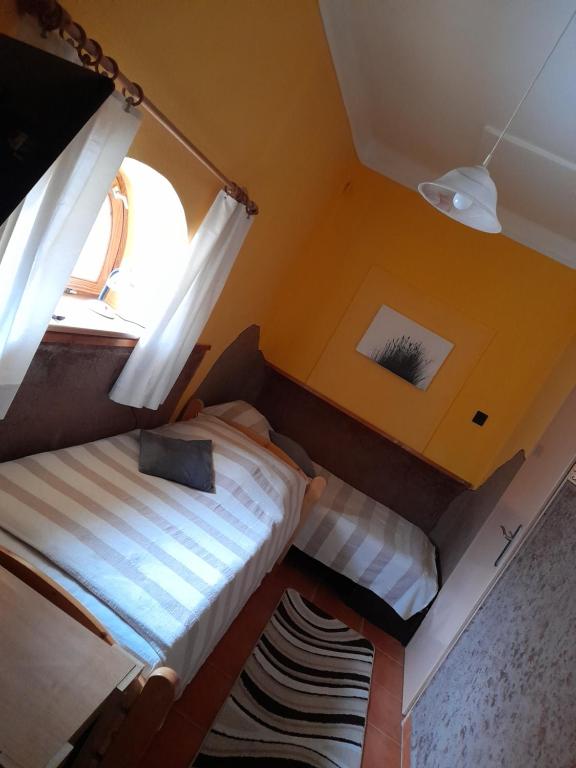 Postel nebo postele na pokoji v ubytování Agave Apartman