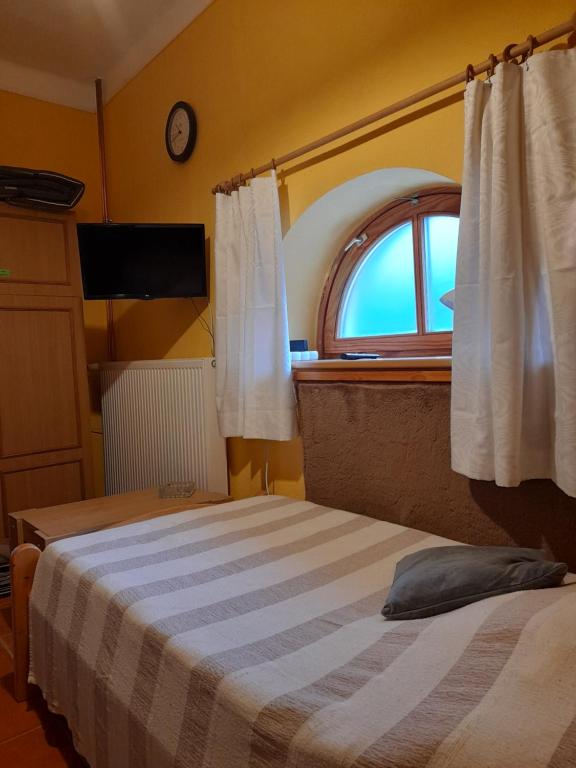 Postel nebo postele na pokoji v ubytování Agave Apartman