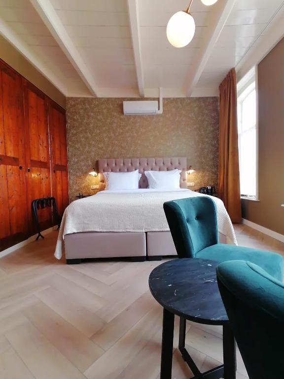 Postel nebo postele na pokoji v ubytování B&B De Stadssingel