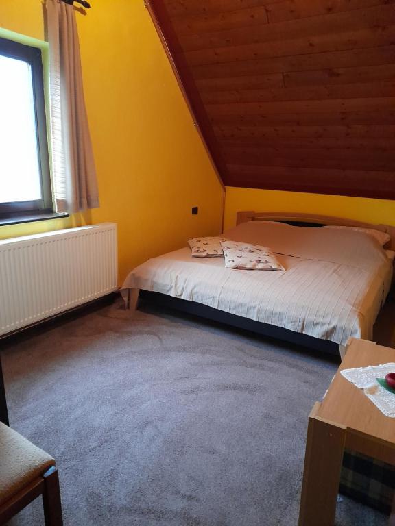 Postel nebo postele na pokoji v ubytování Agave Apartman