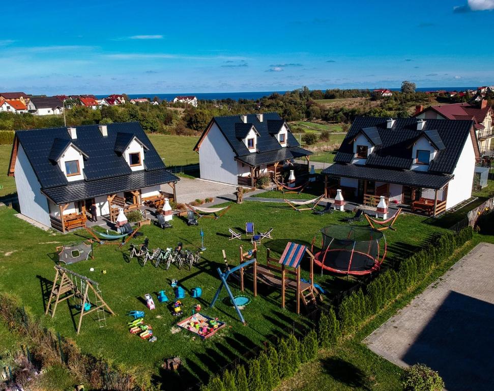an aerial view of a house with a playground at Domki Marco Polo in Władysławowo