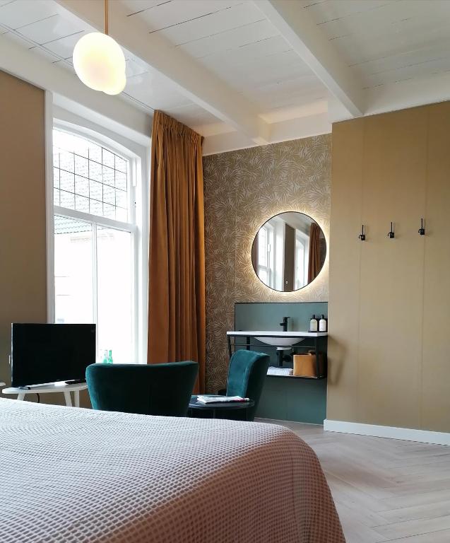 Postel nebo postele na pokoji v ubytování B&B De Stadssingel