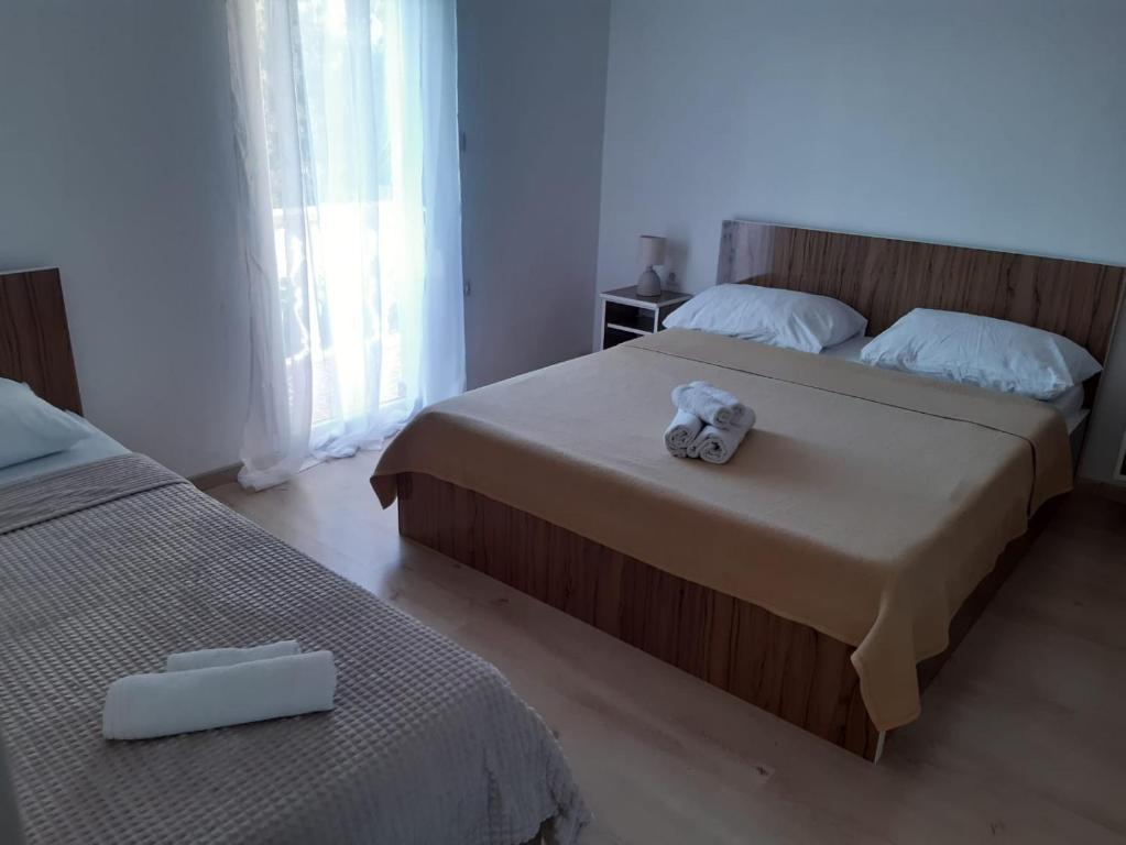 מיטה או מיטות בחדר ב-Apartment Luka