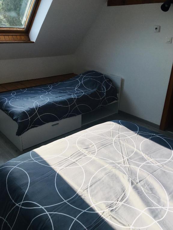 Postel nebo postele na pokoji v ubytování Gîte de la Salamandre - 4 à 8 personnes - Climatisé
