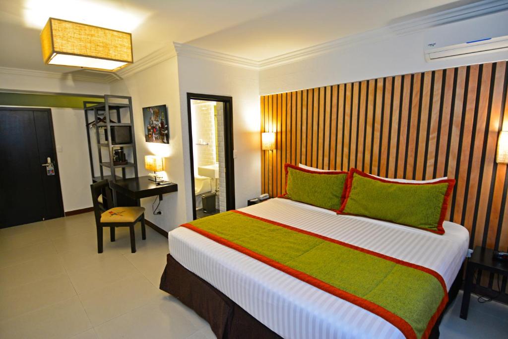 Postel nebo postele na pokoji v ubytování Auténtico Hotel