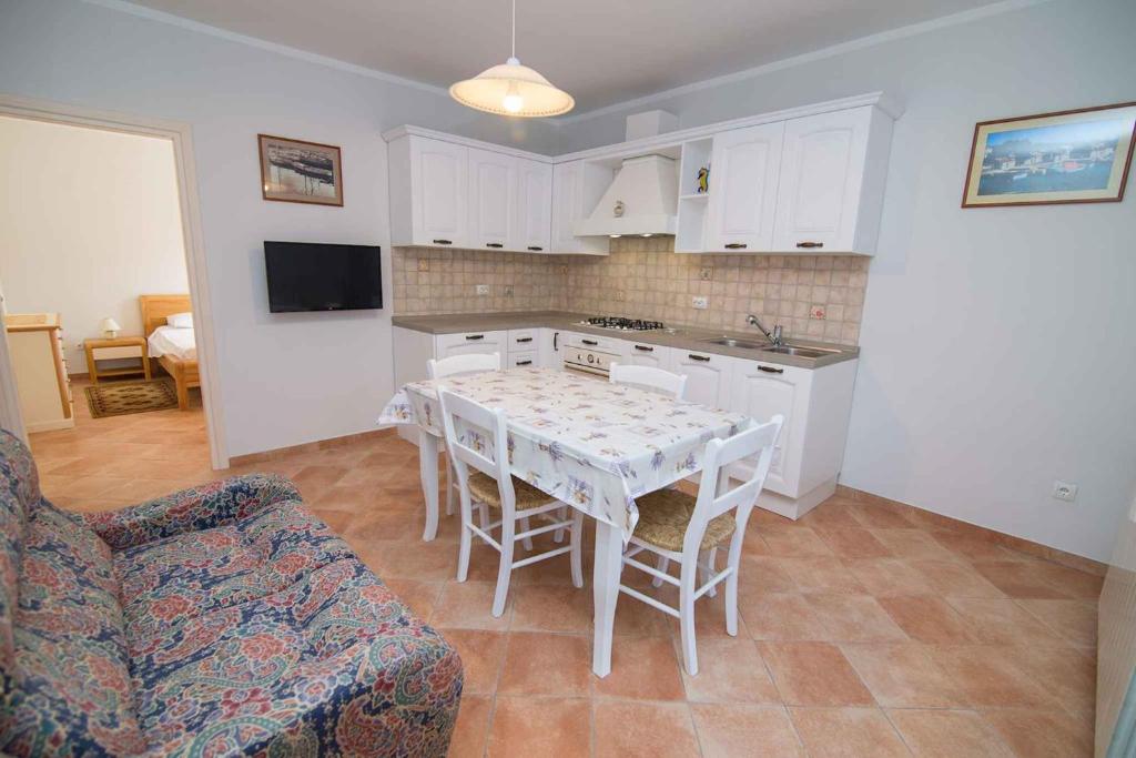 Televízia a/alebo spoločenská miestnosť v ubytovaní Studio in Mali Losinj 36544