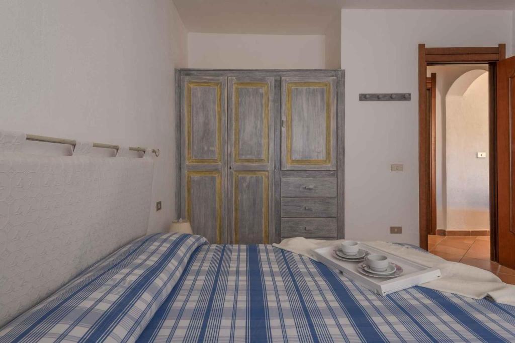 Łóżko lub łóżka w pokoju w obiekcie Holiday home in Golfo Aranci 30357