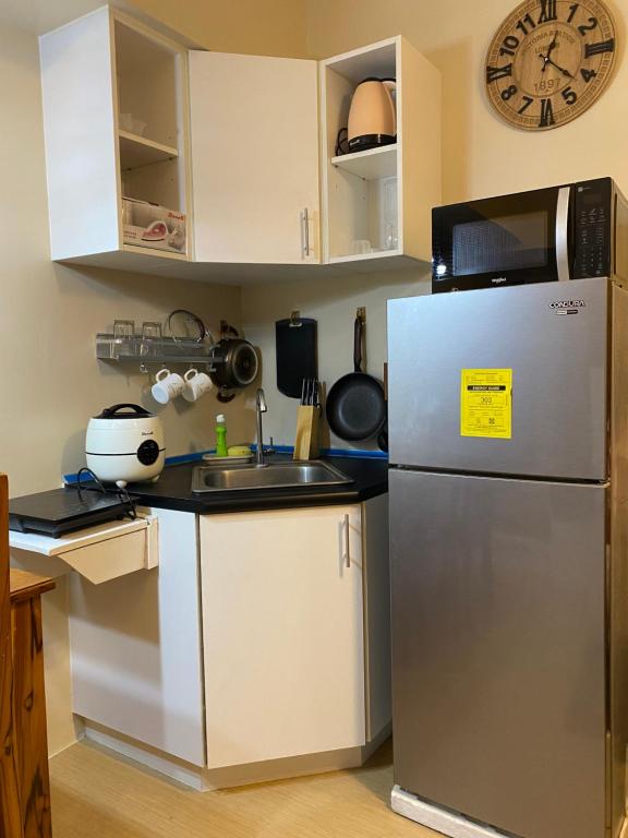 Kuchyň nebo kuchyňský kout v ubytování Avida Atria Khalexa's Place Iloilo