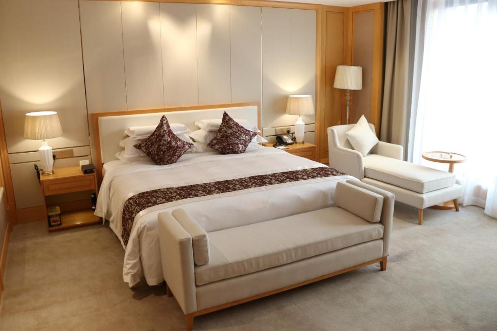 Postel nebo postele na pokoji v ubytování 淮北伯瑞特酒店有限公司