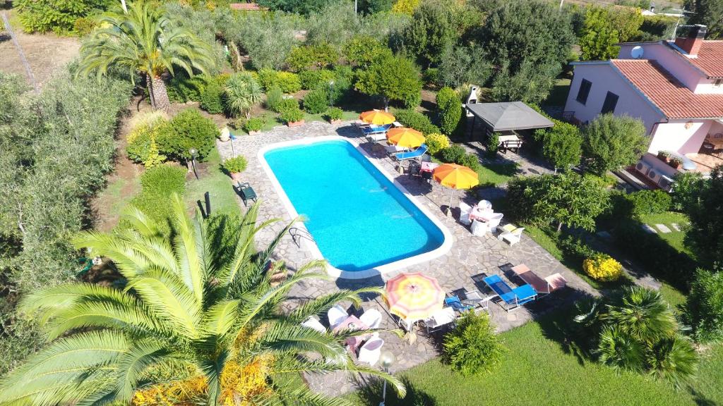 an overhead view of a swimming pool in a backyard at Casa Maremma in Castiglione della Pescaia